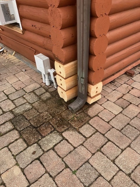 Bottom log course replaced where ground contact had caused decay