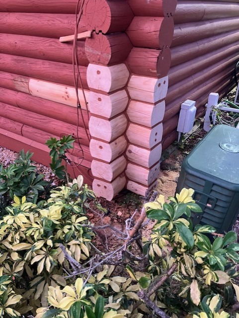 Replaced corner log ends on a log home before the finish is matched in