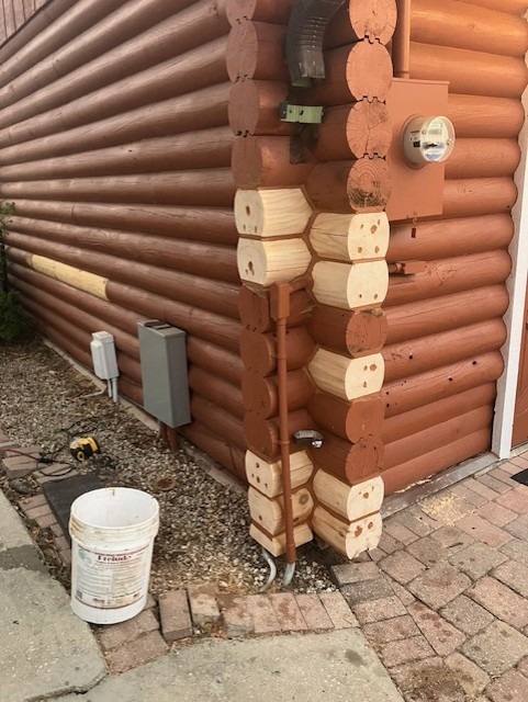 Corner log ends replaced with new wood, awaiting stain to match the wall