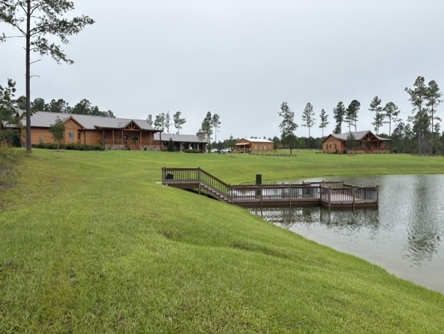 Log homes and a dock on a waterfront property