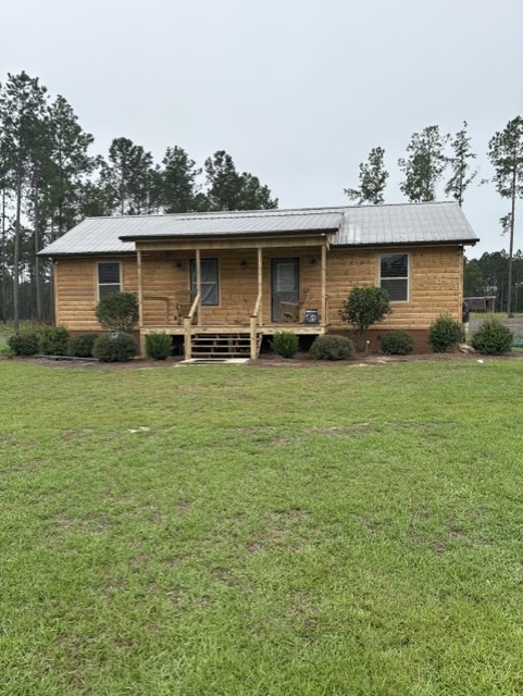Log cabin finished in a light natural-tone stain