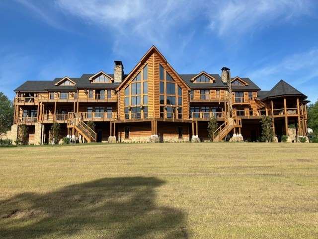 Full elevation of a large log lodge after exterior restoration