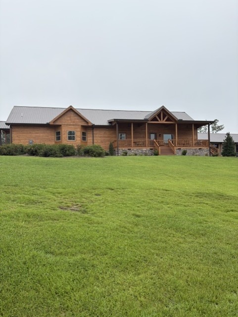 Long single-story log home elevation after exterior restoration